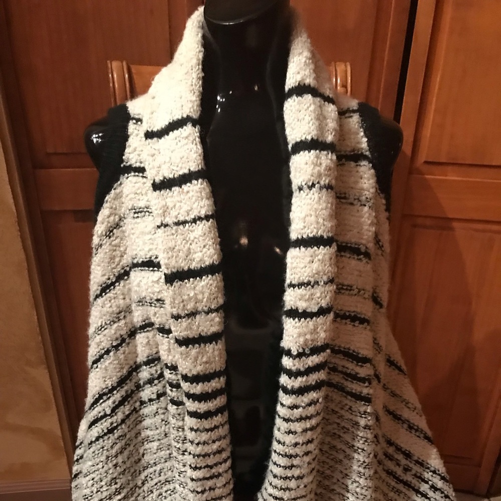 Ana black and cream colored sleeveless vest